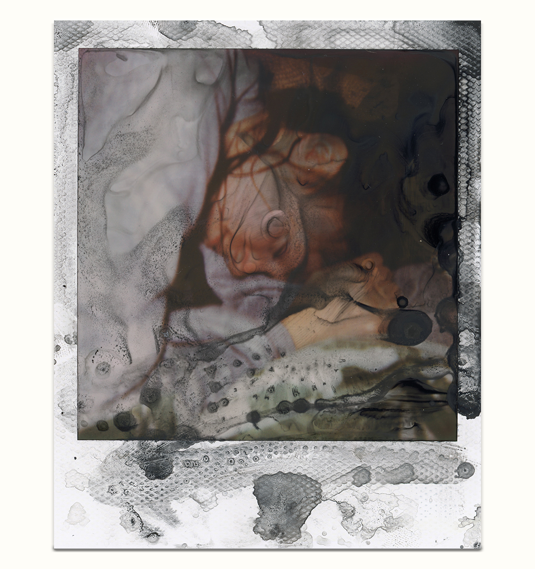 White frame Polaroid Instant Film 600 with chemical deterioration coloured like black ink containing one young women sleeping.