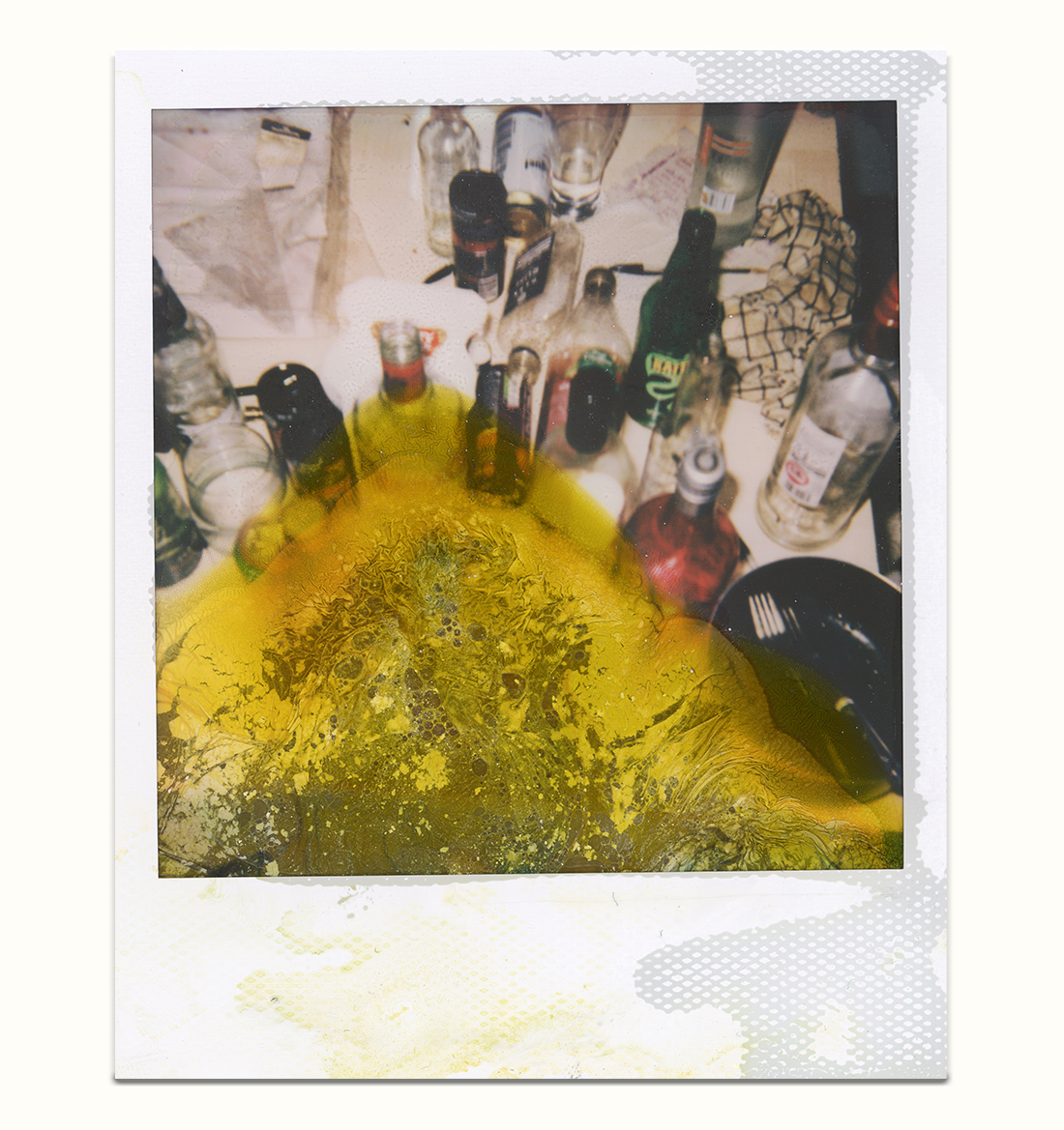 White frame Polaroid Instant Film 600 with lime green liquid and chemical deterioration from the bottom featuring dirty table with alcohol containers.